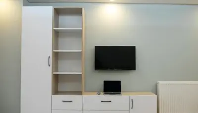 a living room with a tv on a wall at Sare House in Istanbul