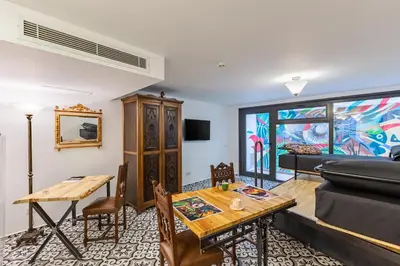 a living room with a table and a couch at Villa Pera Suite Hotel in Istanbul