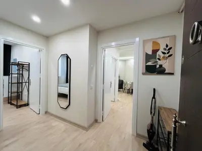 a room with a hallway with a mirror and a staircase at Westley Residence Taksim in Istanbul