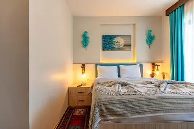 a bedroom with a bed and a window at Stanpoli Hostel in Istanbul