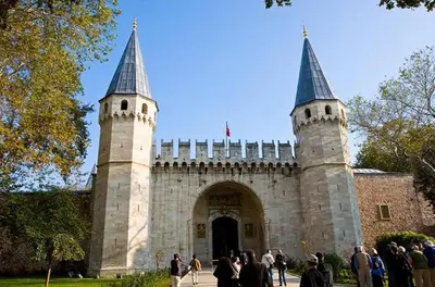 a castle with two towers and people standing in front of it at Vizyon Hotel - Old City in Istanbul