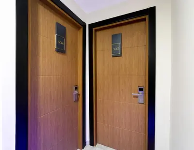 two doors with numbers on them in a building at Vizyon Hotel - Old City in Istanbul