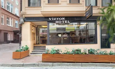 a view of a restaurant with plants in front of it at Vizyon Hotel - Old City in Istanbul