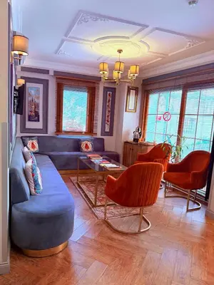 a living room with a blue couch and chairs at Interstar Hotel - Sultanahmet in Istanbul