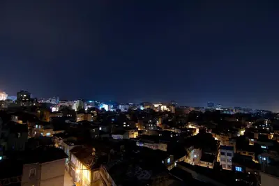 a view of a city at night at Endless Suites Taksim in Istanbul