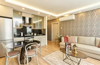 a living room with a couch and a table at All Seasons Suites in Istanbul