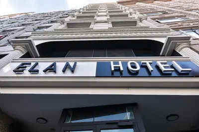 a sign on the side of a ham hotel building at Elan Hotel Istanbul Pera in Istanbul