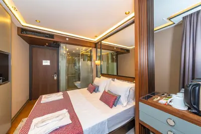 a bedroom with a large bed in a room at Opale Hotel in Istanbul