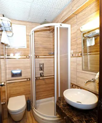 a bathroom with a shower and a toilet and a sink at Elysion Hotel in Istanbul