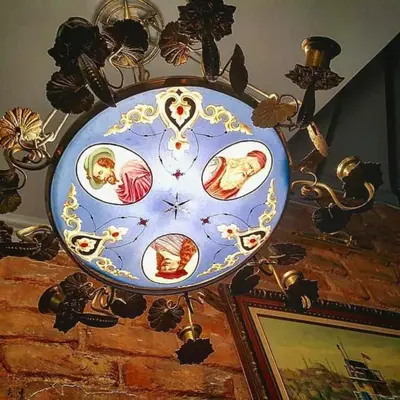 a blue and gold clock is hanging on a wall at Faik Pasha Hotels Special Category Beyoglu Istanbul in Istanbul
