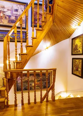 a staircase in a house with paintings on the wall at Faik Pasha Hotels Special Category Beyoglu Istanbul in Istanbul