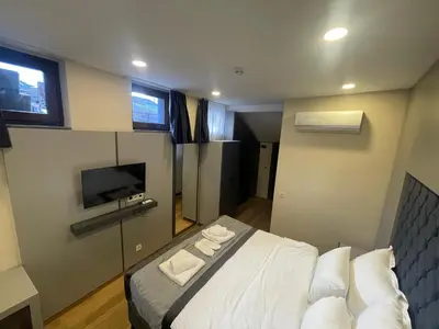 a bedroom with a bed and a tv in it at Spinel Hotel - Old City in Istanbul