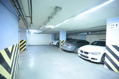 a garage with two cars parked in it at Bursa Palas Hotel in Bursa