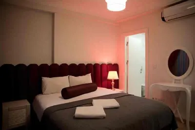 a bedroom with a large bed with two towels on it at Nupelda Residence Hotel in Istanbul