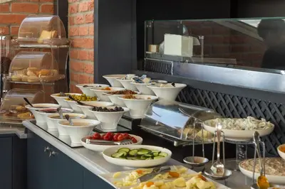 a buffet line with many different types of food at Meroddi La Porta in Istanbul