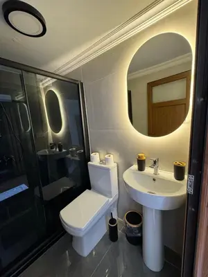 a bathroom with a toilet and a sink and a mirror at Tavra hotel in Istanbul
