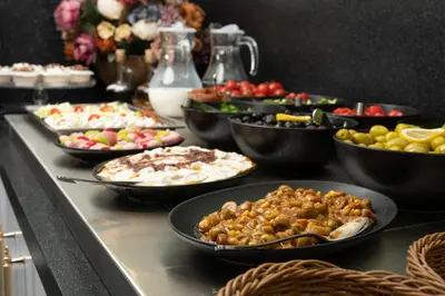 a buffet with many different types of food on a table at Elm Suite Hotel in Istanbul
