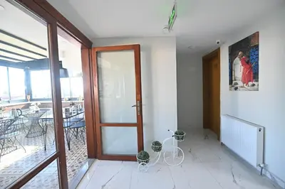 a room with a glass door and a bike on the floor at Safir Gold Hotel in Istanbul