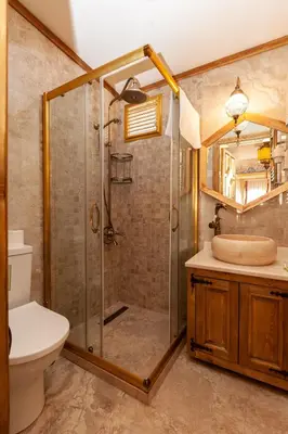 a bathroom with a shower and a toilet and a sink at Enderun by Otantik Suites in Istanbul