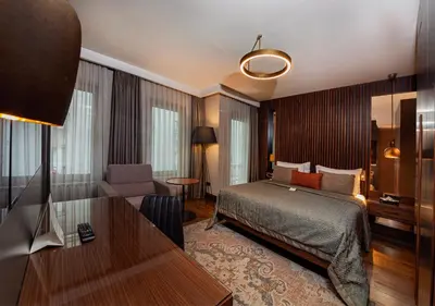 a hotel room with a bed and a desk at Levni Plus Hotel in Istanbul