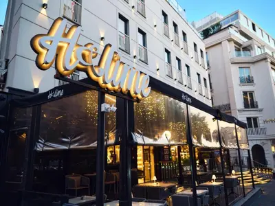 a restaurant with tables and chairs in front of a building at Stayso The House Hotel in Istanbul
