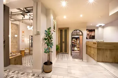 a large hallway with a lobby with a pharmacy at Hotel Des Arts Galata in Istanbul