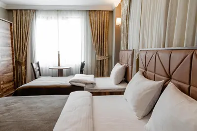 a hotel room with a bed and a window at madame roza in Istanbul