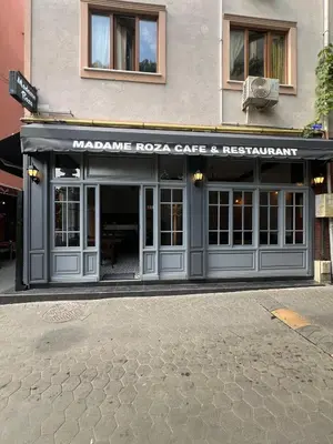 a building with aazaaza cafe and restaurant on a street at madame roza in Istanbul