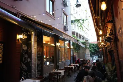 a group of people sitting at tables in a restaurant at madame roza in Istanbul