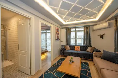 a living room with a couch and a table at Dorne Suite Taksim Hotel in Istanbul