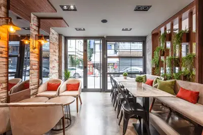 a restaurant with a long table and chairs at Sherry Suites Karaköy in Istanbul