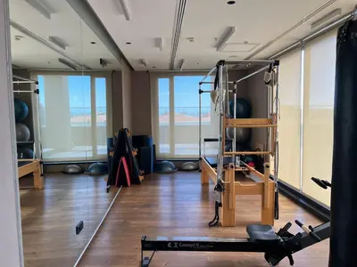 a room with a gym with a treadmill and weights at Akmerkez Residence in Istanbul
