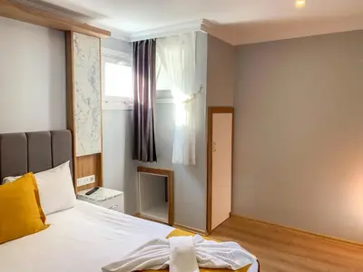 a bedroom with a bed and a window at Sultanahmet Nu Hotel in Istanbul