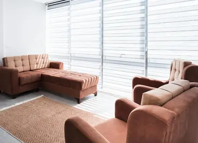 a living room with two chairs and a couch at Araz Suit in Burgaz