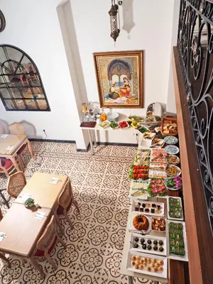 a buffet line with plates of food in a room at Nusretbey Hotel in Istanbul