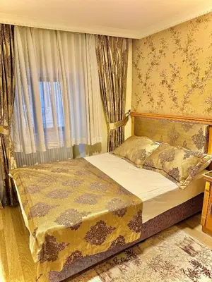 a bedroom with a bed and a window at Grand Papirus Hotel in Istanbul