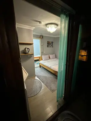 a small room with a bed and a window at Nelly Guesthouse in Istanbul