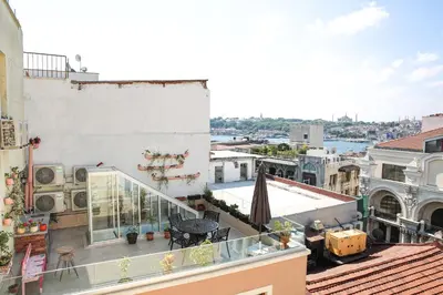 an apartment balcony with a view of a city at No 8 Galata in Istanbul