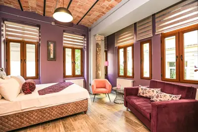 a bedroom with a bed and a couch at No 8 Galata in Istanbul