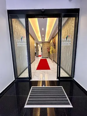 a hallway with a red carpet in a building at Vander Valk İstanbul Hotel in Istanbul