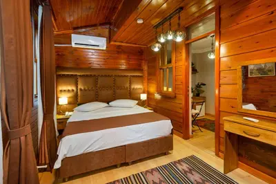 a bedroom with a bed in a room with wooden walls at Wonder Wood Hotel in Istanbul