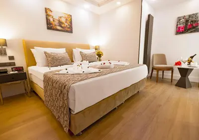 a bedroom with a bed with two towels on it at Antusa Design Hotel & Spa in Istanbul