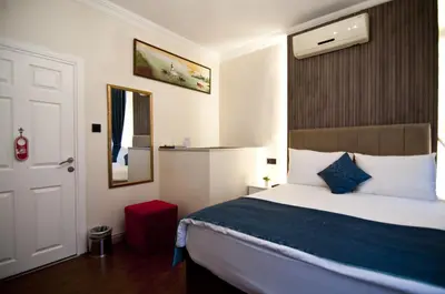 a hotel room with a bed and a mirror at Genius Hotel Istanbul in Istanbul