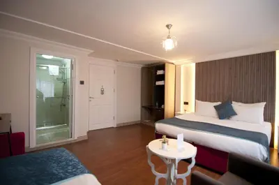 a hotel room with a bed and a table at Genius Hotel Istanbul in Istanbul