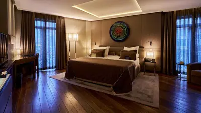 a bedroom with a large bed in a room with windows at Lasagrada Hotel Istanbul in Istanbul