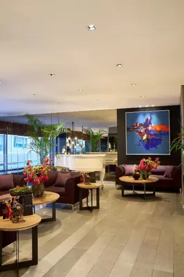 a lobby with couches and a large tv in a building at Lasagrada Hotel Istanbul in Istanbul