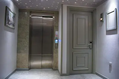 a elevator corridor with a door in a building at Mayer Hotel Istanbul in Istanbul