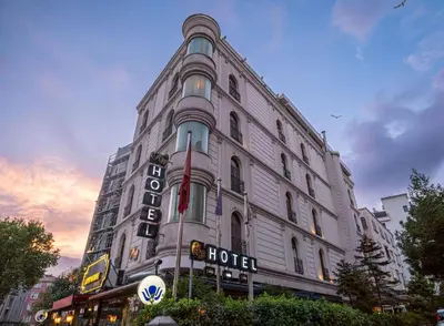 a large white building with a hotel sign on it at Myy Boutique Hotel in Istanbul