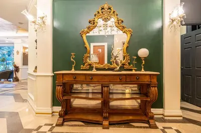 a mirror on top of a wooden dresser in a room at Myy Boutique Hotel in Istanbul