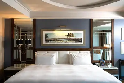 a bedroom with a large bed and a painting on the wall at Radisson Blu Hotel Istanbul Pera in Istanbul